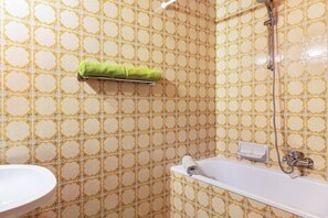 Bathtub, hair dryer, towels