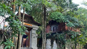 A traditional building with a stone facade and a sign reading "DJAWATA". - Djawata resort & gallery  (Bangunjiwo)