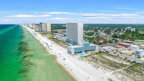 A coastal hotel with a beach view, multiple high-rise buildings, and a clear blue sky. - FB Terrace Studio! Inquire for Monthly Rates (Panama City Beach)