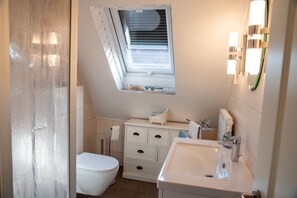 Shower, hair dryer, towels, soap