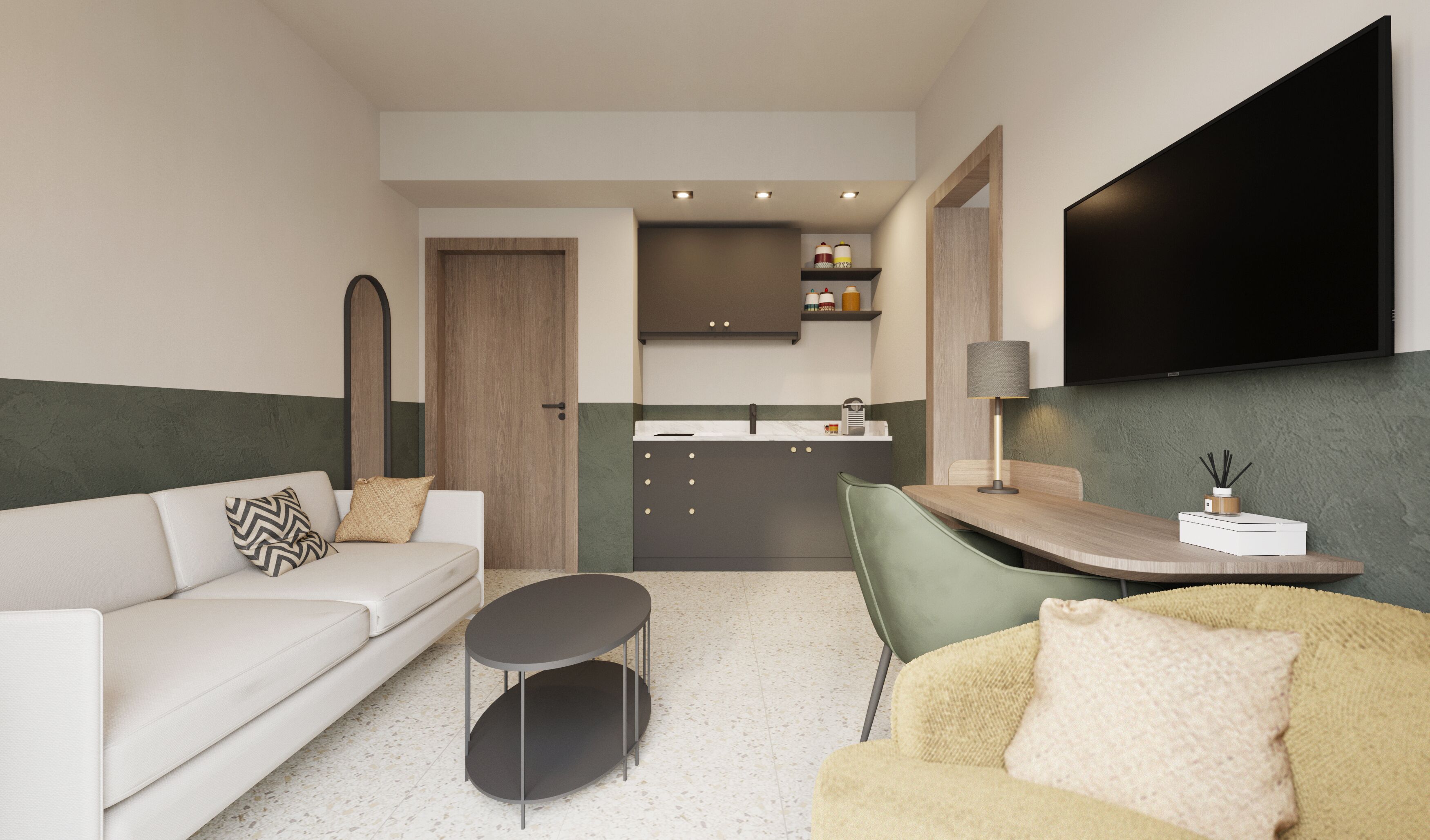 Una sala de estar moderna con un sofá, una mesa de centro redonda, una zona de comedor con mesa y sillas, un área de cocina con armarios y un televisor de pantalla plana montado en la pared.