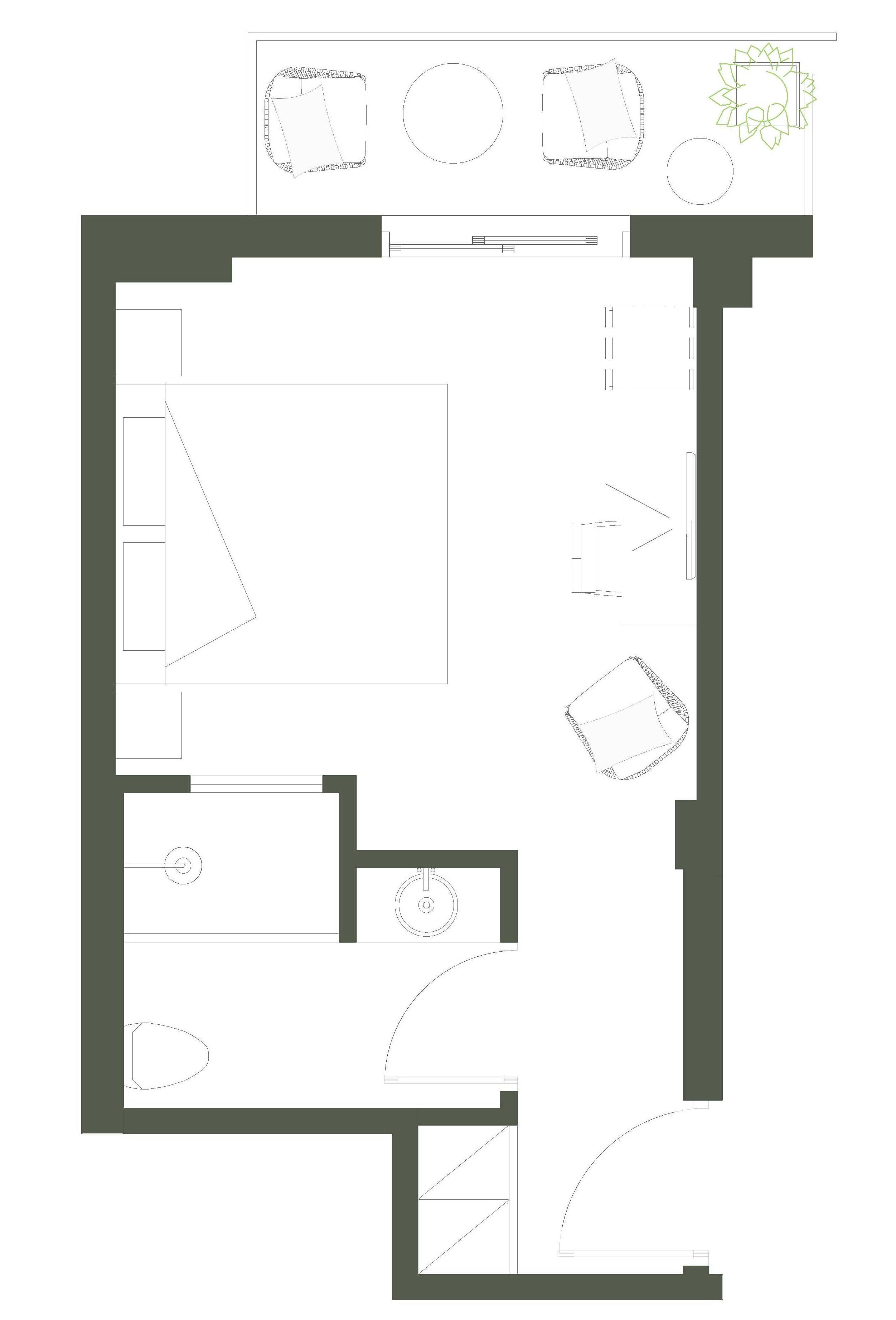 Planta baixa de um hotel com cozinha, sala de jantar e um pequeno jardim ao ar livre.