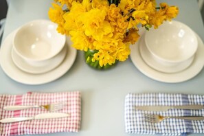 Enjoy a simple, inviting dining experience with a beautifully set table.