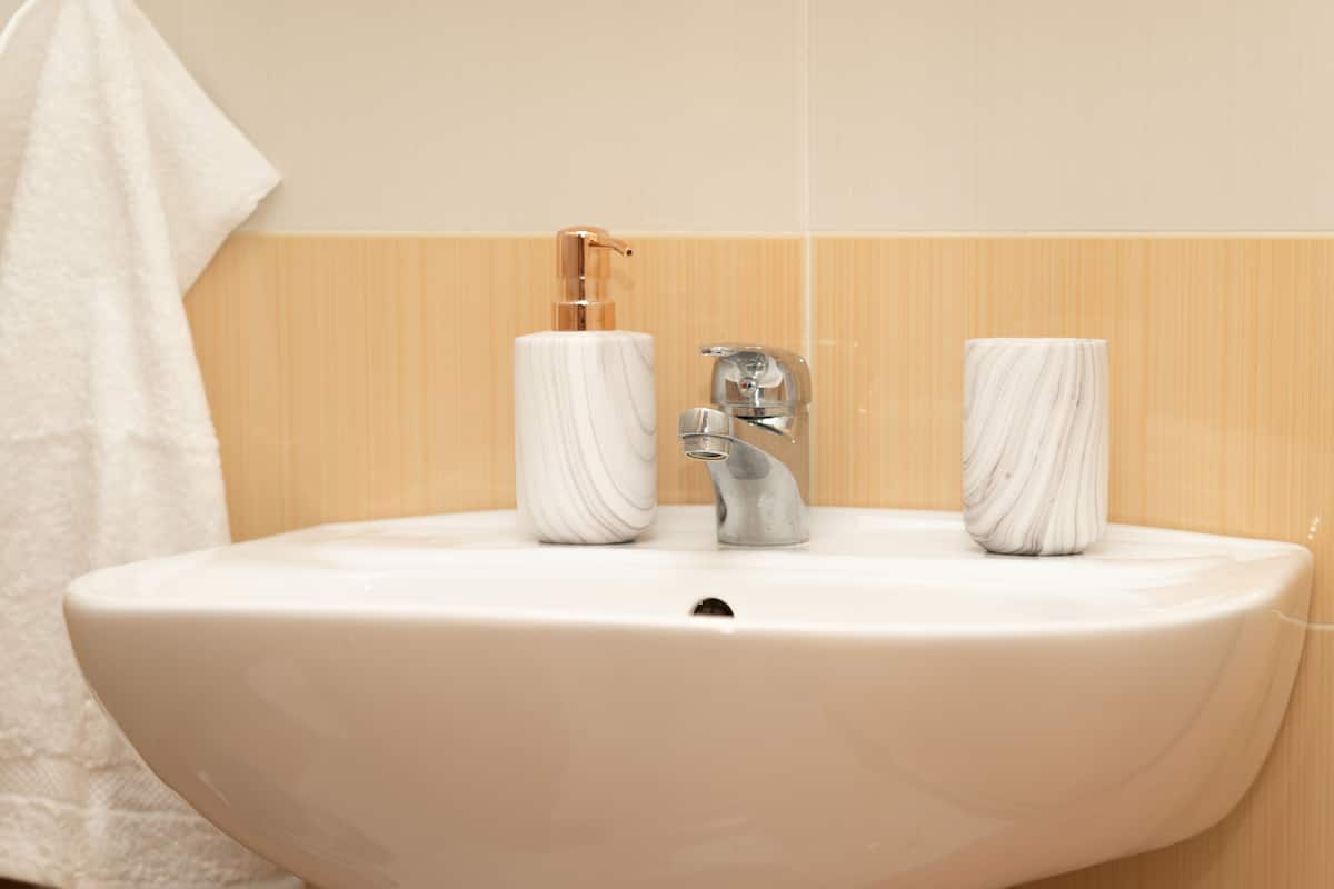 standard apartment | bathroom | shower, hair dryer, towels, soap