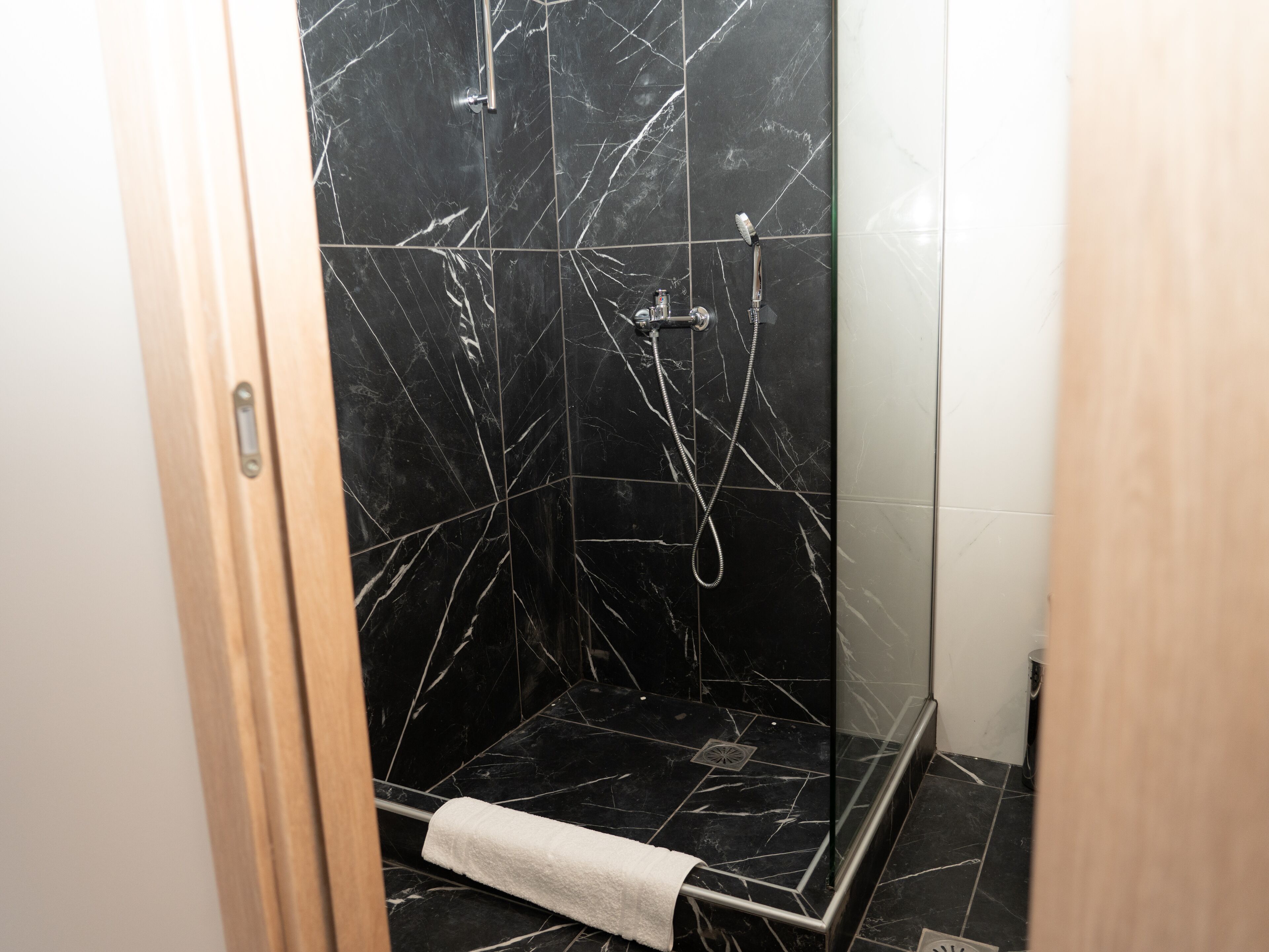 deluxe apartment | bathroom | shower, hair dryer, towels, soap