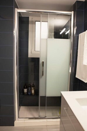 Shower, hair dryer, towels, soap