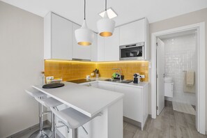 Fridge, oven, coffee/tea maker, cookware/dishes/utensils