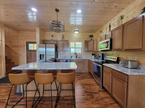 Fridge, stovetop, toaster, cookware/dishes/utensils