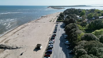 Enjoy a serene beachside retreat with access to the sandy shoreline and scenic views of the surrounding landscape.