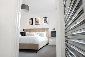 4 bedrooms, desk, iron/ironing board, travel cot