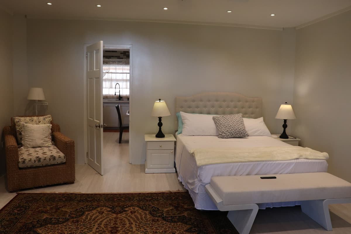 Family Apartment, 2 Bedrooms, Ocean View | Premium bedding, laptop workspace, blackout drapes, iron/ironing board