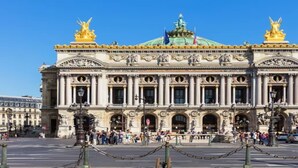 A grand historic building with classical architecture, featuring columns, statues, and ornate decorations. - Nestled along the Que banks of Seine -perfection in intimate luxury near Louvre (Paris)