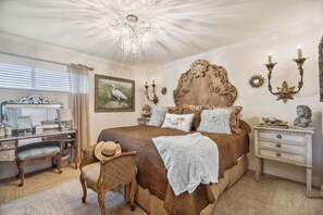 A bedroom with a large bed, a desk, a chair, and a dresser. - Beachfront Luxury Condo in Quiet Laguna Beach w/Amazing Views! Free Perks! (Panama City Beach)