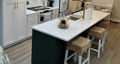 Unique waterfront home, Hot Tub, private boat dock, walk to beach, pet friendly