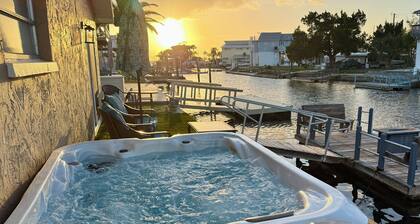 Unique waterfront home, Hot Tub, private boat dock, walk to beach, pet friendly