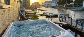 Unique waterfront home, Hot Tub, private boat dock, walk to beach, pet friendly
