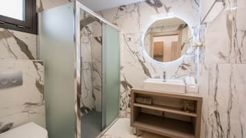 Shower, hair dryer, towels, toilet paper