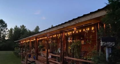 Log Cabin house on 10.5 acers of wooded land. Accommodates 20 plus guest.