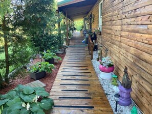 Terrace/patio - Log Cabin house on 10.5 acers of wooded land. Accommodates 20 plus guest.  (Remus)