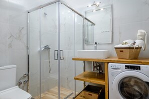 Shower, hair dryer, towels, soap