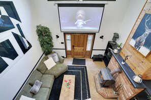 Smart TV, fireplace, table football, books