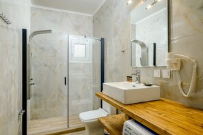 Shower, hair dryer, towels, soap