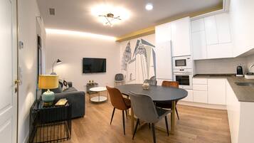 Deluxe Apartment | Living area | 55-inch flat-screen TV with cable channels, TV