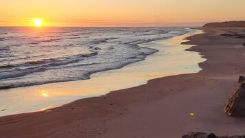 On the beach, sun loungers, beach towels