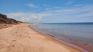 On the beach, sun loungers, beach towels