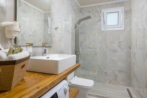 Shower, hair dryer, towels, soap