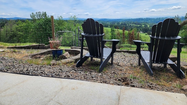 Two Adirondack chairs facing a scenic view of a mountainous landscape. - Springdale Farm & Views - the Gorge, Downtown, Mt. Hood (Troutdale)