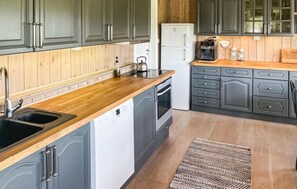 Fridge, dishwasher, coffee/tea maker, cookware/dishes/utensils
