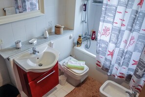 Bathtub, hair dryer, bidet
