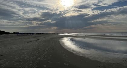 Stones throw from shore! Spacious multi-level townhome one row back from beach