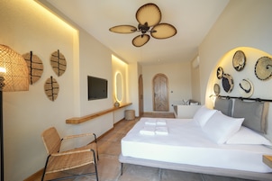 Deluxe Room, 1 Bedroom, Sea View, Beachfront | 1 bedroom, minibar, desk, laptop workspace