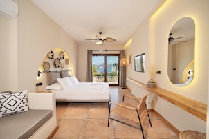 Deluxe Room, 1 Bedroom, Sea View, Beachfront | 1 bedroom, minibar, desk, laptop workspace