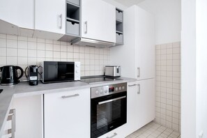 Fridge, microwave, oven, cookware/dishes/utensils