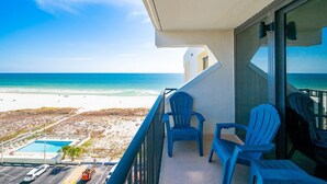A balcony with a view of the beach and ocean. - Island Winds West 871 2 Bedroom Condo (Gulf Shores)