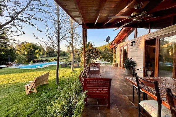 Covered terrace overlooking the garden, ideal for slow mornings or sunset drinks