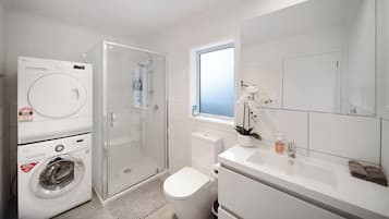 Shower, hair dryer, towels, soap