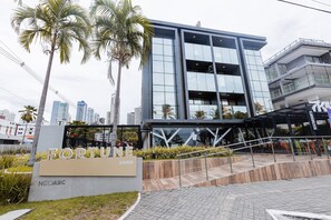 A modern building with a sign reading "FORTUNE 2098" and "NCOABC" below it.