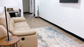 Deluxe Apartment | Living area | 55-inch LED TV with digital channels, TV, Netflix