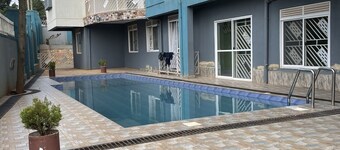 Fully-furnished 2BR/2BA Condo in Kampala with WiFi, gym, pool, Gated Community