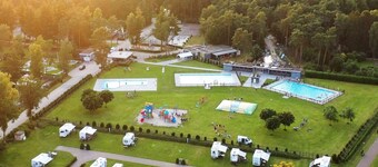 chalet with covered terrace on campsite with pool