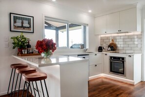 Fridge, microwave, oven, stovetop - Poolside Stay with City Views | Close to the Redwoods for Forest Adventures (Rotorua)