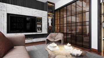 Deluxe Apartment | Living area | TV