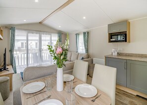 Living area - 3 bedroom Ribchester Platinum Caravan with balcony at the front. (Longridge, Ribble Valley)
