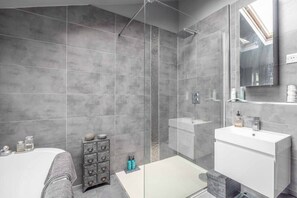 Bathtub, hair dryer, towels