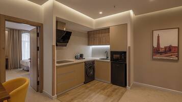 Comfort Apartment | Private kitchen | Coffee/tea maker, electric kettle, kitchen islands