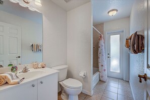 Bathtub, hair dryer, towels